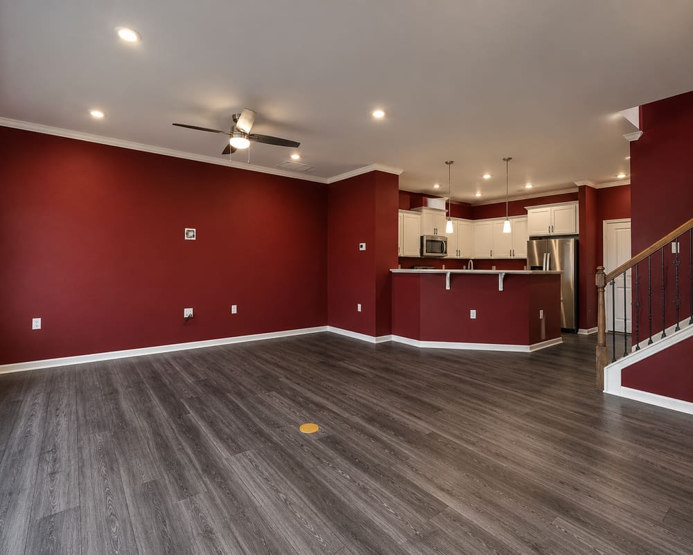Interior wall before painting, with a bold, dated red accent color